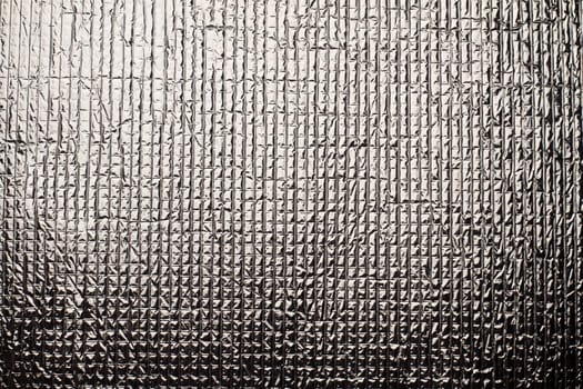 closeup detail of industrial shinny aluminum metal background texture with embossed square shapes