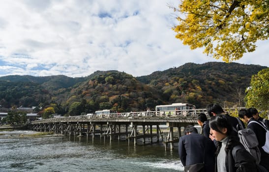 KYOTO, JAPAN -NOVEMBER 24, 2016: Togetsukyo bridge over Katsura river during autumn season in Arashiyama, Kyoto, Japan