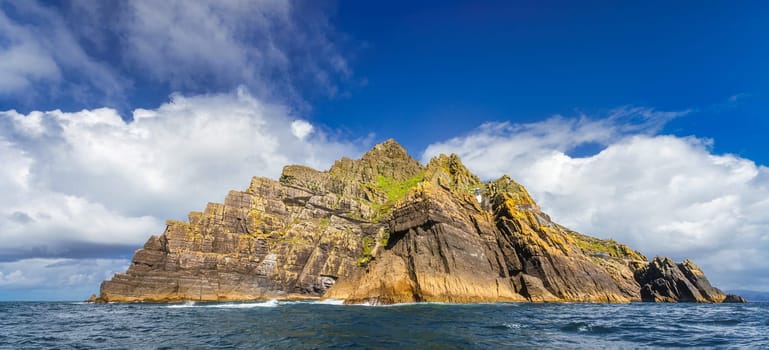 Skellig Lighthouse sticks out from behind off the rock. Skellig Michael island where Star Wars were filmed UNESCO World Heritage Ring of Kerry Ireland