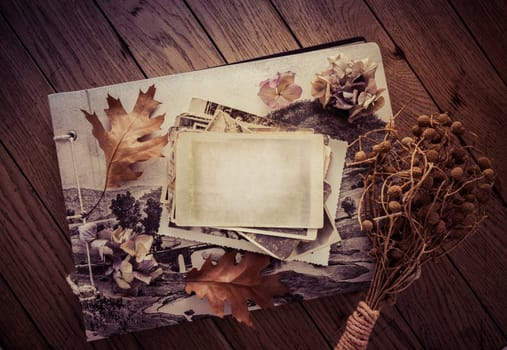 Memories - stock of old and vintage photos on wooden background with copy space