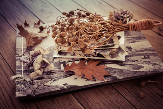 Memories - stock of old and vintage photos on wooden background