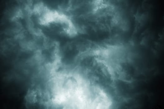 Thick dark black storm clouds covering summer sunset sky with gale-speed wind blowing just before Nor'westers Kalbaishakhi Bordoisila thunderstorm torrential rain. Atmospheric Texture background.