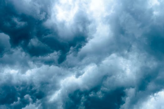 Thick dark black storm clouds covering summer sunset sky with gale-speed wind blowing just before Nor'westers Kalbaishakhi Bordoisila thunderstorm torrential rain. Atmospheric Texture background.