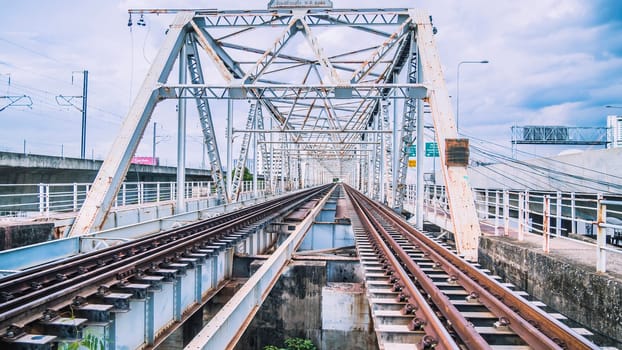 Train trestle bridge over river . the railway bridge of iron.