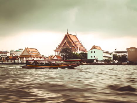 January 2019,Bangkok Thailand river of Bangkok and skyscrapper highrise building cityscape riverscape taxi boat serve for public transportation  old town temple background