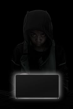 Hacker boy are hacking through the laptop on a black background.