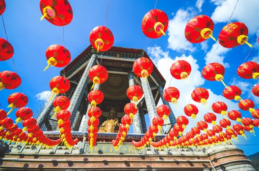 Guanyin and a red lanterns in Chinese Temple Penang, Malaysia. Kek Lok Si Temple Place of worship near Georgetown. a Chinese Buddhist temple situated in Air Itam in Penang.