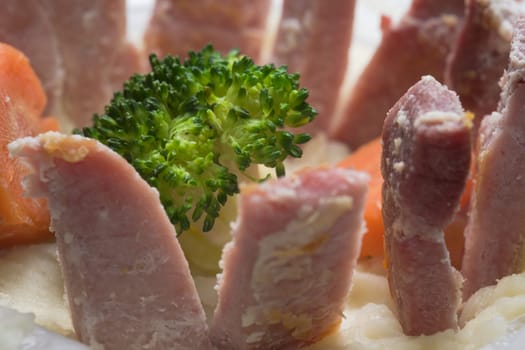 Mix of ready meals and cooked frozen veg, combined into a balanced evening meal. Striking and unusual presentation giving a full frame abstract image