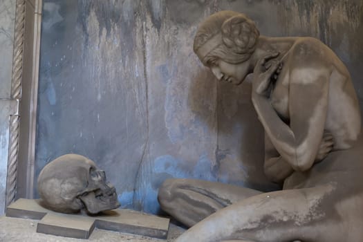 GENOA, ITALY - June 2020: antique statue, beginning 1800, made of marble, in a Christian Catholic cemetery - Italy