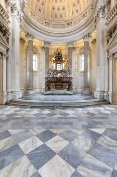 VENARIA REALE, ITALY - CIRCA MAY 2021: sacred catholic altar in Baroque style and cupola. Day light.