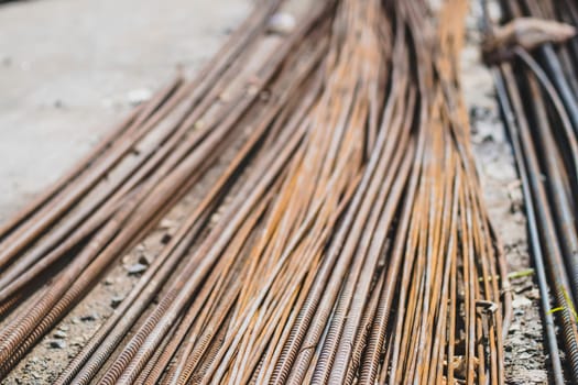 stack of straight old rusty high yield stress deformed reinforcement steel or iron bars.construction work.structure work