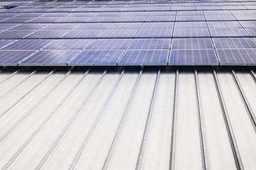 Aerial top view of a solar panels power plant. Renewable energy concept . Detailed close-up of modern large photovoltaic solar panels