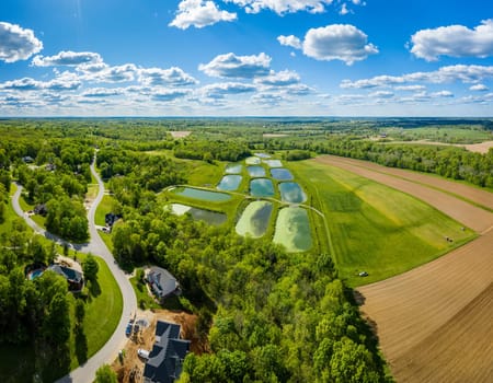 Aerial view of sewage treatment lagoons and a residential neighborhood near Georgetown, Kentucky