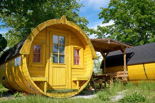 Wooden sleeping barrel to spend the night on a campsite in Germany