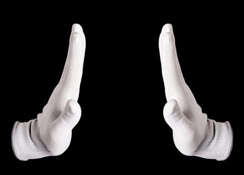 The white gloved hand on a black background. A hand in a white glove shows stop sign on a black background