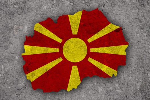 Map and flag of North Macedonia on weathered concrete