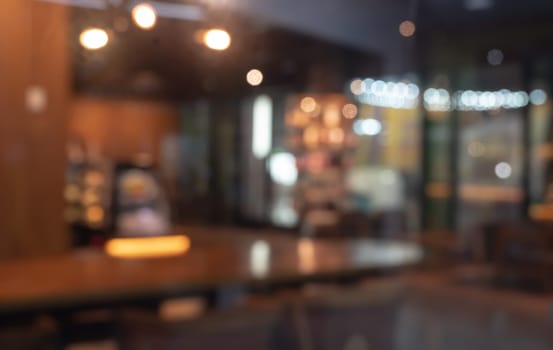 Defocused image of shop or cafe with bokeh coloful night lights background