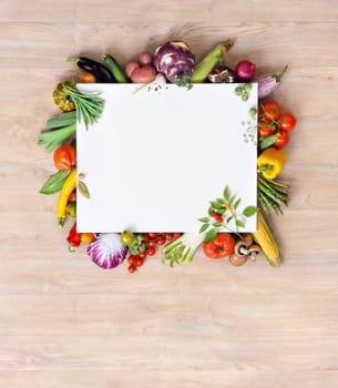Healthy food background and Copy space / studio photography of white paper surrounded by fresh vegetables on old wooden table. Healthy food background, top view. High resolution product