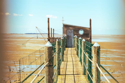 Hut of the fisherman and jetty in Yves bay, France