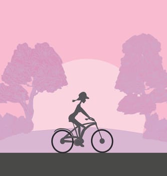 the girl rides a bicycle during sunrise