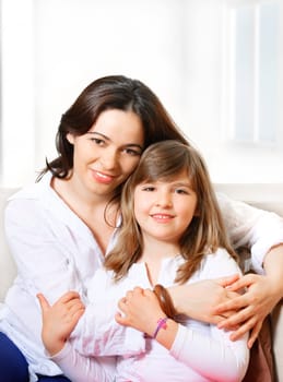 Portrait of happy mother and her smililing daugther