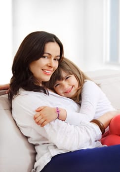 Portrait of happy mother and her smiling daughter