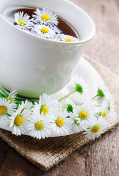 healthy lifestyle concept. Pure natural tea on wooden plank.