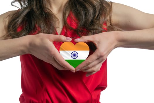 Love India The woman holds a heart in the form of the flag of India on her chest. Concept of patriotism.