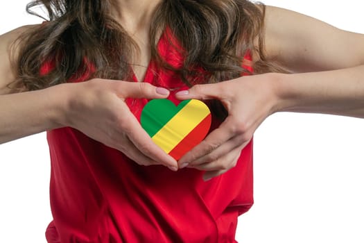 Love Republic of the Congo The woman holds a heart in the form of the flag of Republic of the Congo on her chest. Concept of patriotism.