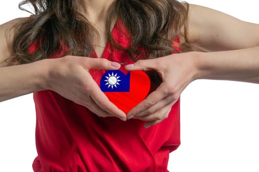 Love Republic of China. The woman holds a heart in the form of the flag of Republic of China on her chest. Concept of patriotism.