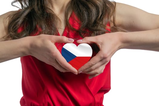 Love Czech Republic. The woman holds a heart in the form of the flag of Czech Republic on her chest. Concept of patriotism.