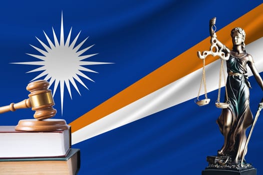 Law and justice in Marshall Islands. Statue of themis and the gavel of the judge against the background of the flag of Marshall Islands. Law and justice concept.