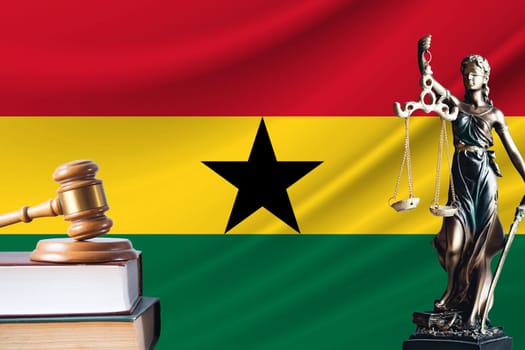 Law and justice in Ghana. Statue of themis and the gavel of the judge against the background of the flag of Ghana. Law and justice concept.