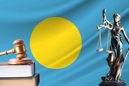Law and justice in Palau. Statue of themis and the gavel of the judge against the background of the flag of Palau. Law and justice concept.