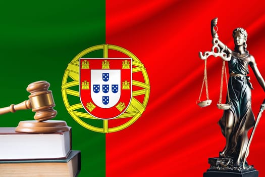 Law and justice in Portugal. Statue of themis and the gavel of the judge against the background of the flag of Portugal. Law and justice concept.