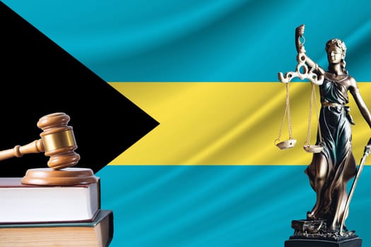 Law and justice in Bahamas. Statue of themis and the gavel of the judge against the background of the flag of Bahamas. Law and justice concept.