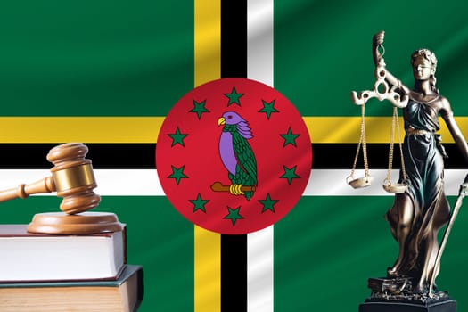 Law and justice in Dominica Statue of themis and the gavel of the judge against the background of the flag of Dominica