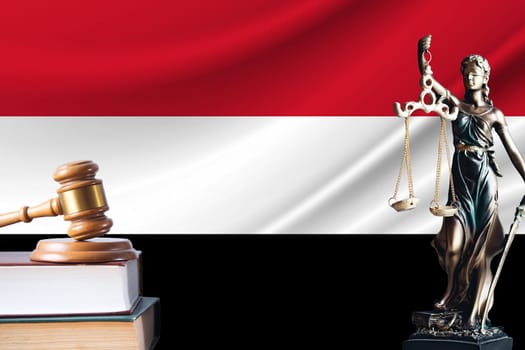 Law and justice in Yemen Statue of themis and the gavel of the judge against the background of the flag of Yemen