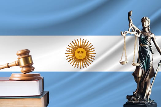 Law and justice in Argentina. Statue of themis and the gavel of the judge against the background of the flag of Argentina. Law and justice concept.