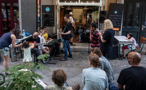 Musicians play during Summer solsticem 2021 in a Burgershop in Berlin while offocial Fête de la Musique don't happen because of Corona pandemic