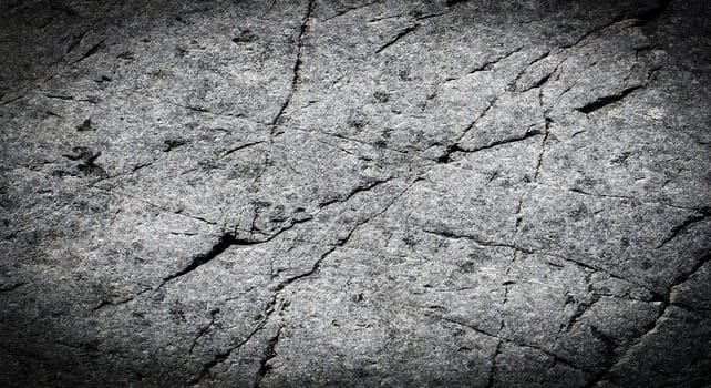 The Dark grey black stone background or texture. Selective focus