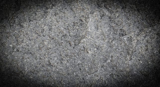 The Dark grey black stone background or texture. Selective focus