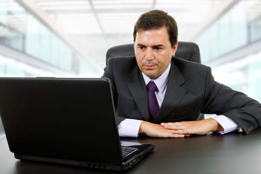 businessman working with is laptop at the office