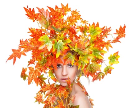 Beautiful young woman wrapped in autumn leafs