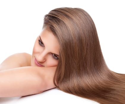 Beautiful young brunette with long straight and shiny hair