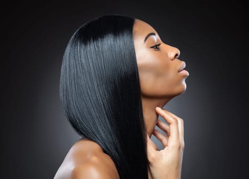 Profile of a black beauty with perfect straight and shiny hair
