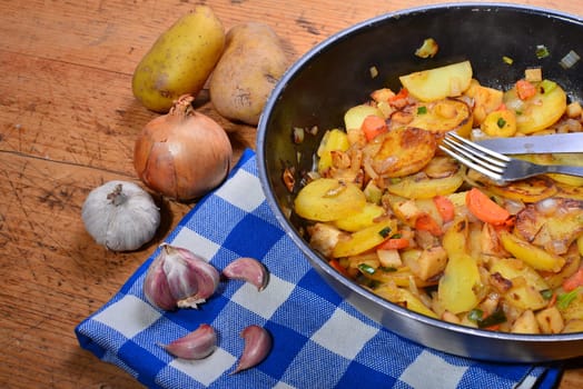 Roast potatoes in a black pan