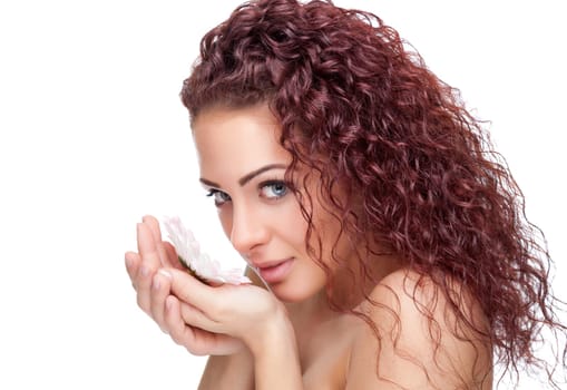 Beautiful young woman with red curly hair