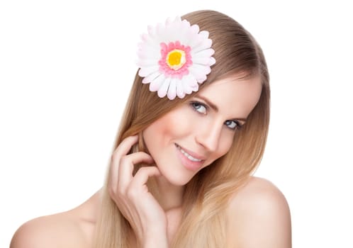 Beautiful young woman with a flower in her hair