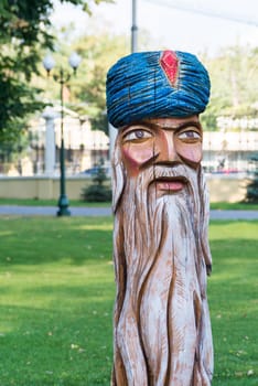 A wood sculpture in a park for fun kids